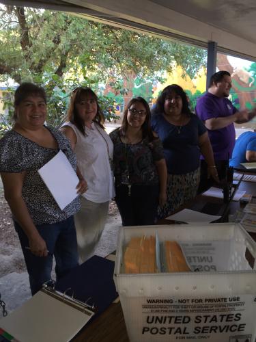 Mrs. Rosy, Mrs. Cheryl, Mrs. Martha, and Ms. Carina assist families with registration.