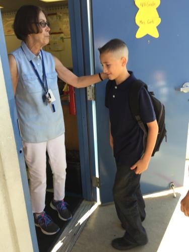 Mrs. Corti welcomes a student.