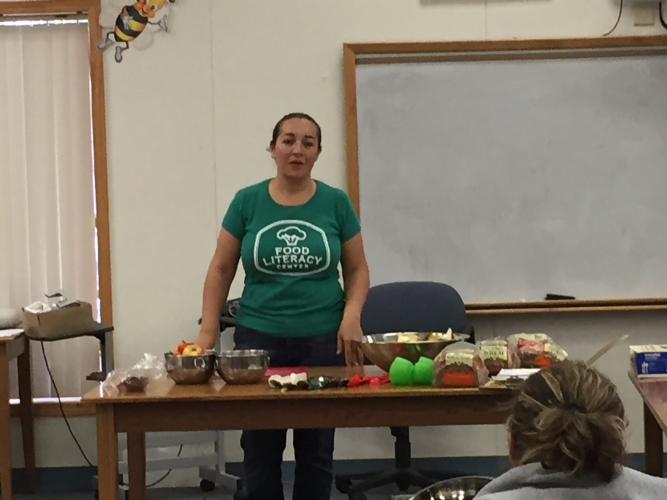 Chef Ruiz from Food Literacy presents healthy meal choices to families at the Pacific December Parent Coffee Chat